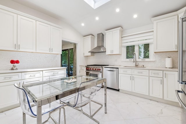18 Woodcrest Rd, Kings Point, NY 11024 - kitchen featuring wall chimney exhaust hood, a sink, stainless steel appliances, light marble finish flooring, and recessed lighting