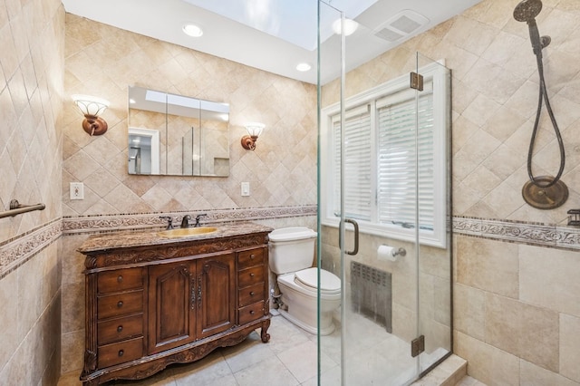 18 Woodcrest Rd, Kings Point, NY 11024 - bathroom featuring tile walls, vanity, toilet, a shower stall, and tile patterned floors