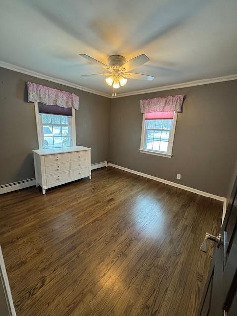 158 Parrott Rd, West Nyack, NY 10994 - spare room featuring healthy amount of natural light, dark wood-style flooring, crown molding, baseboards, and a ceiling fan