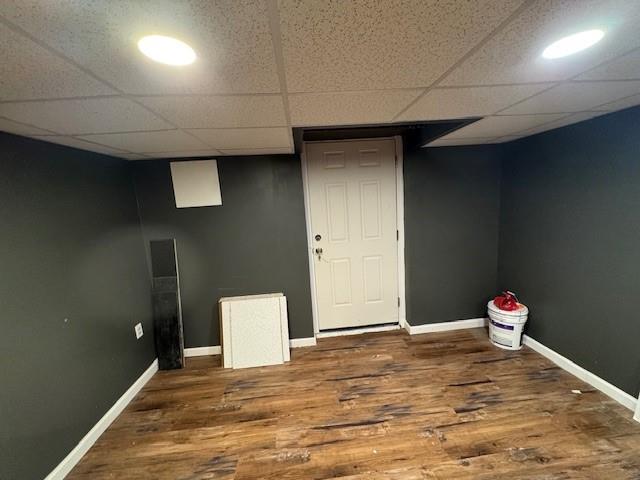 158 Parrott Rd, West Nyack, NY 10994 - finished below grade area featuring a paneled ceiling, wood finished floors, and baseboards