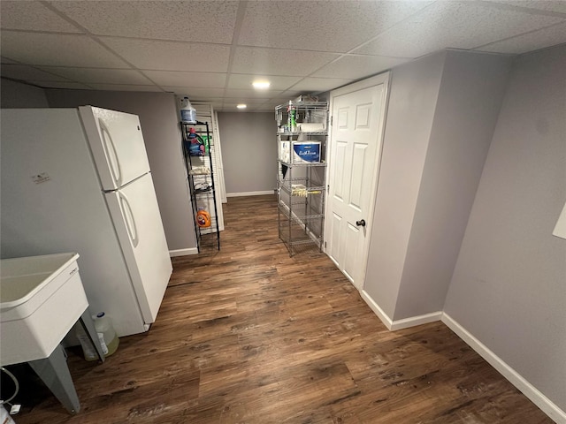 158 Parrott Rd, West Nyack, NY 10994 - kitchen with a paneled ceiling, baseboards, freestanding refrigerator, and dark wood finished floors