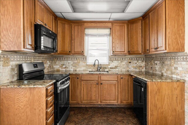 0 Cross Bay Blvd, Broad Channel, NY 11693 - kitchen with black appliances, brown cabinetry, light stone counters, a sink, and decorative backsplash