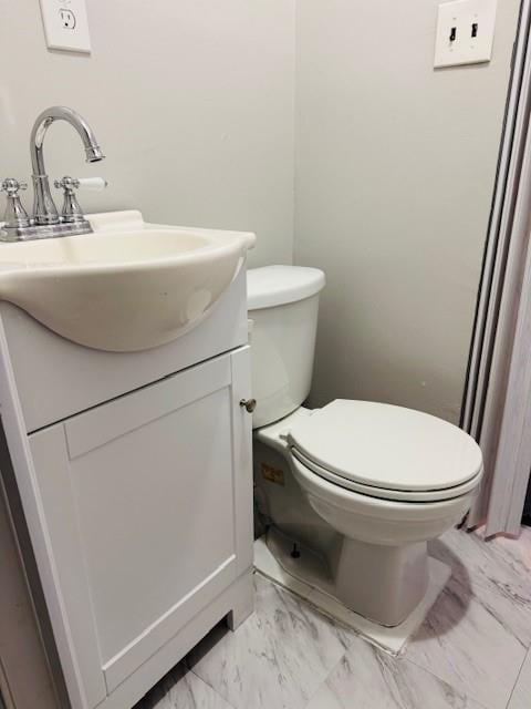 0 Cross Bay Blvd, Broad Channel, NY 11693 - bathroom with vanity, marble look tile flooring, and toilet