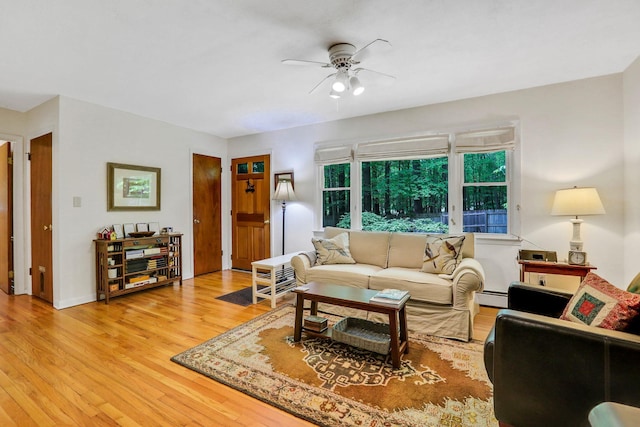 512 Watson Woods Rd, Woodstock, NY 12498 - living area with a ceiling fan, a baseboard heating unit, and light wood-style floors