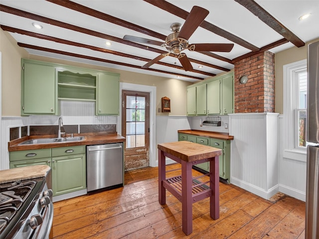 31 Hudson Ave, Stony Point, NY 10980 - kitchen with stainless steel appliances, green cabinets, beam ceiling, light wood-type flooring, and wainscoting