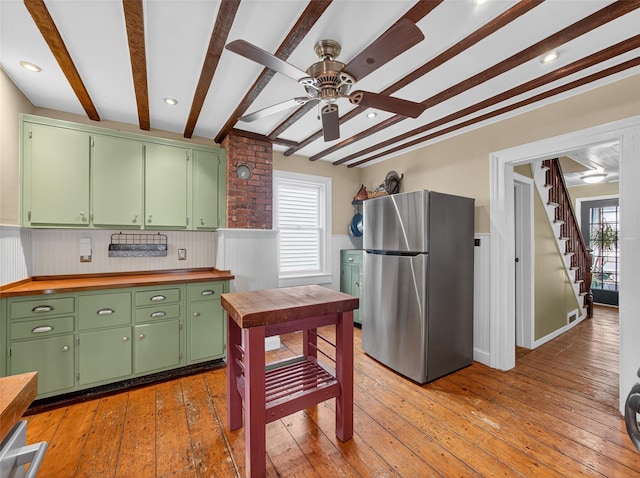 31 Hudson Ave, Stony Point, NY 10980 - kitchen with freestanding refrigerator, beamed ceiling, a ceiling fan, a wainscoted wall, and wood counters