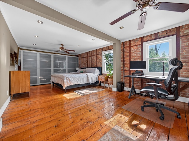 31 Hudson Ave, Stony Point, NY 10980 - bedroom with brick wall, multiple windows, wood-type flooring, and an office area