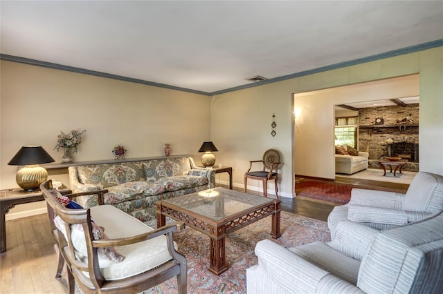 100 Foxhunt Cres, Oyster Bay Cove, NY 11791 - living room with hardwood / wood-style flooring, ornamental molding, baseboards, and a fireplace