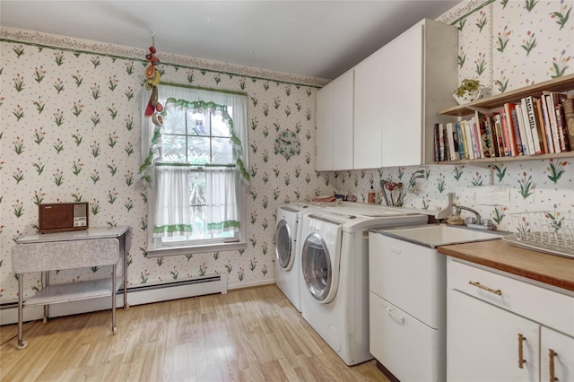 100 Foxhunt Cres, Oyster Bay Cove, NY 11791 - washroom featuring cabinet space, light wood-type flooring, washer and dryer, wallpapered walls, and baseboard heating