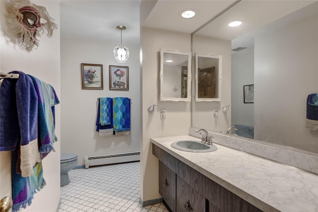 100 Foxhunt Cres, Oyster Bay Cove, NY 11791 - bathroom featuring a baseboard heating unit, toilet, vanity, and baseboards