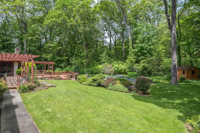 100 Foxhunt Cres, Oyster Bay Cove, NY 11791 - view of green lawn featuring a pergola, an outbuilding, and a deck