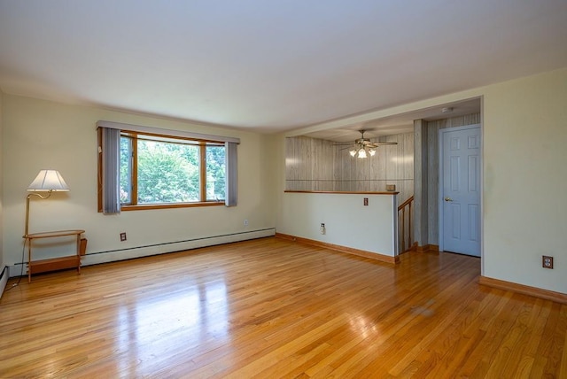6 Regency Dr, Wappingers Falls, NY 12590 - unfurnished living room with light wood finished floors, baseboards, and a ceiling fan