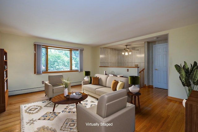 6 Regency Dr, Wappingers Falls, NY 12590 - living area with baseboard heating, wood finished floors, baseboards, and a ceiling fan
