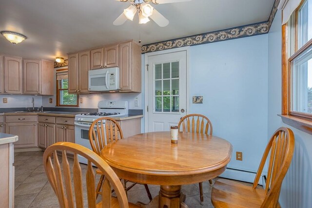 6 Regency Dr, Wappingers Falls, NY 12590 - dining space with ceiling fan, baseboard heating, and light tile patterned flooring