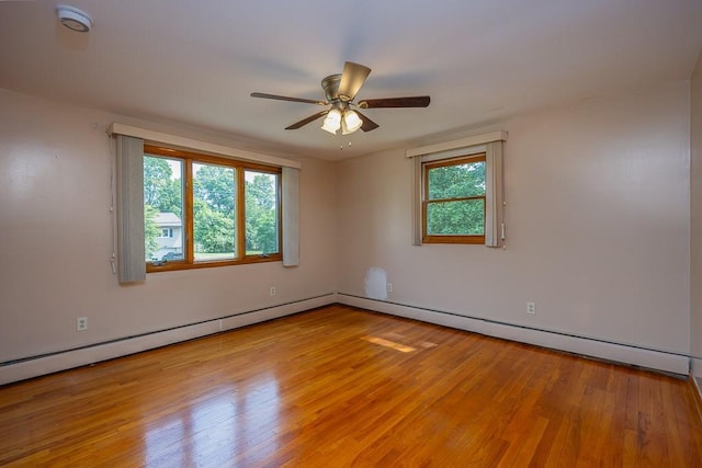 6 Regency Dr, Wappingers Falls, NY 12590 - empty room with light wood-type flooring, a ceiling fan, and a baseboard radiator