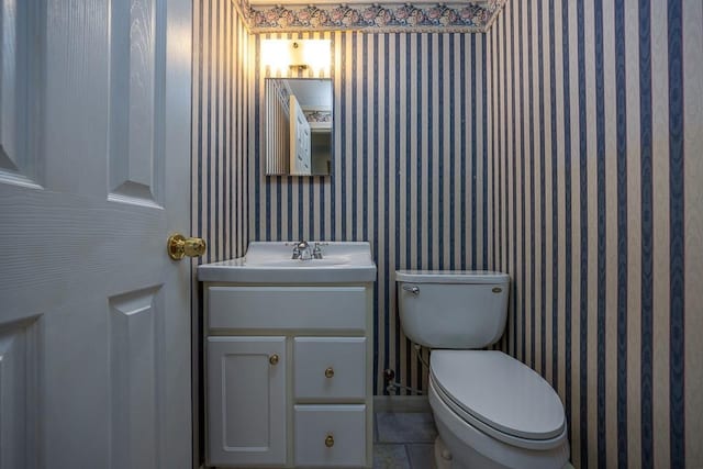 6 Regency Dr, Wappingers Falls, NY 12590 - bathroom featuring vanity, toilet, and wallpapered walls