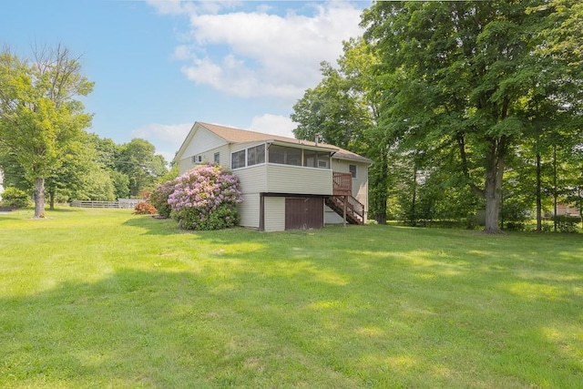 6 Regency Dr, Wappingers Falls, NY 12590 - view of green lawn featuring a sunroom and stairway