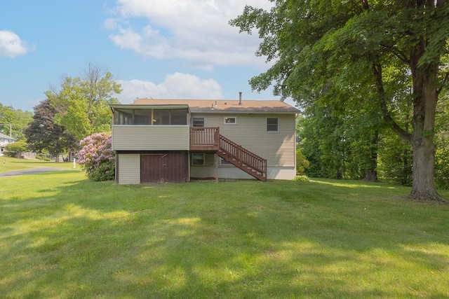 6 Regency Dr, Wappingers Falls, NY 12590 - back of house featuring a sunroom, stairs, and a lawn