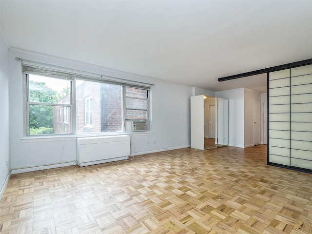 125 Main St Unit 3K, Port Washington, NY 11050 - empty room featuring baseboards and cooling unit
