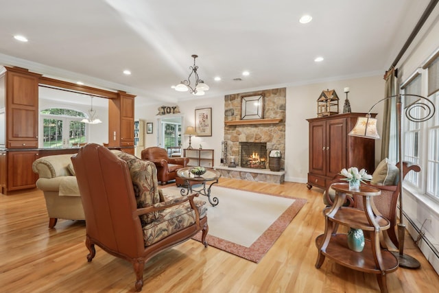 42 Panorama Dr, Warwick, NY 10990 - living area with a chandelier, healthy amount of natural light, a fireplace, recessed lighting, and crown molding