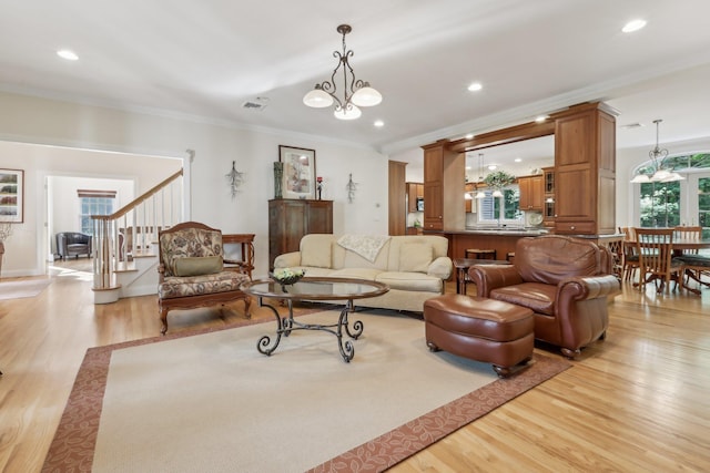 42 Panorama Dr, Warwick, NY 10990 - living room featuring a chandelier, crown molding, light wood finished floors, stairs, and recessed lighting