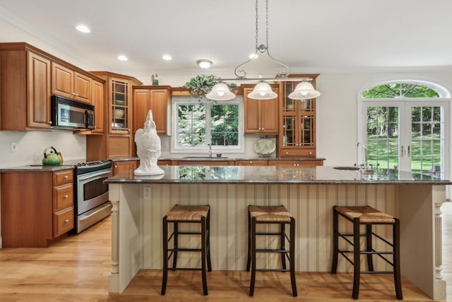 42 Panorama Dr, Warwick, NY 10990 - kitchen featuring appliances with stainless steel finishes, brown cabinetry, a breakfast bar, a sink, and recessed lighting