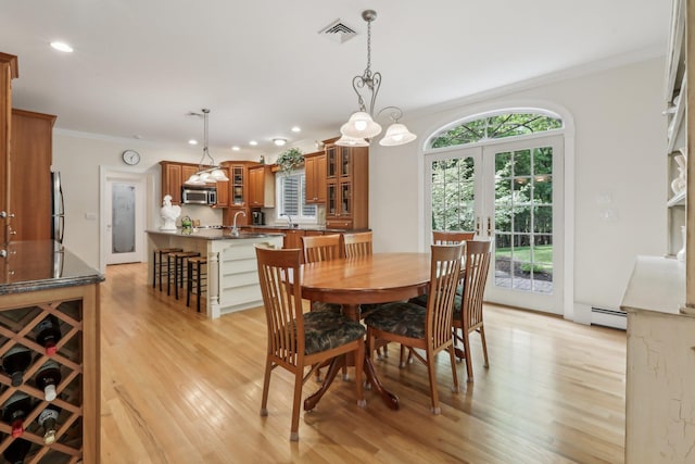 42 Panorama Dr, Warwick, NY 10990 - dining space with crown molding, light wood-style flooring, a baseboard radiator, recessed lighting, and french doors