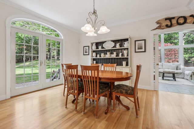 42 Panorama Dr, Warwick, NY 10990 - dining room featuring ornamental molding, french doors, a chandelier, light wood-style flooring, and baseboards