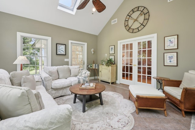 42 Panorama Dr, Warwick, NY 10990 - living room featuring french doors, high vaulted ceiling, ceiling fan, light tile patterned flooring, and a skylight