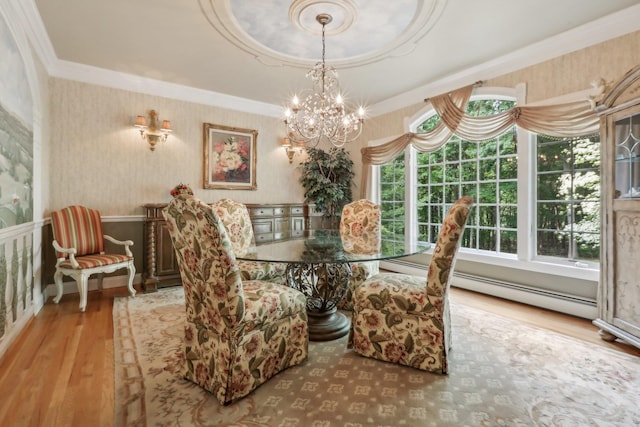 42 Panorama Dr, Warwick, NY 10990 - dining space with wood finished floors, a chandelier, crown molding, wallpapered walls, and baseboard heating