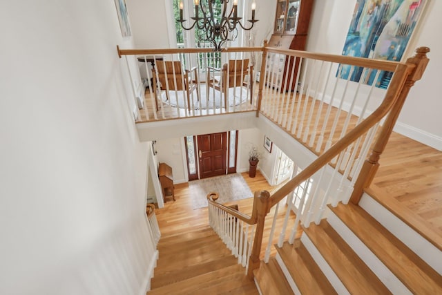42 Panorama Dr, Warwick, NY 10990 - stairway featuring a chandelier, wood finished floors, and baseboards