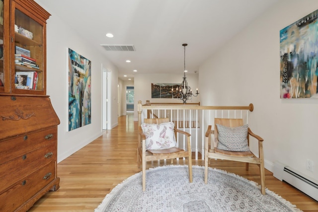 42 Panorama Dr, Warwick, NY 10990 - living area featuring a baseboard radiator, a chandelier, light wood-style flooring, recessed lighting, and baseboards