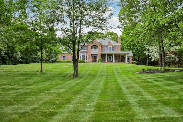 42 Panorama Dr, Warwick, NY 10990 - view of front of property with a front lawn, covered porch, and a chimney