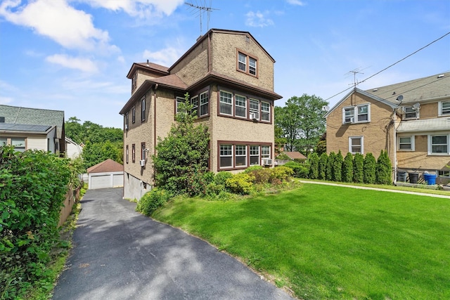 107 Underhill Ave, West Harrison, NY 10604 - view of front of home featuring an outbuilding, a front lawn, and a detached garage