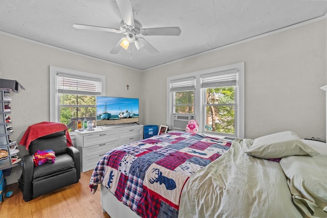 107 Underhill Ave, West Harrison, NY 10604 - bedroom featuring light wood-type flooring, a textured wall, ornamental molding, cooling unit, and ceiling fan