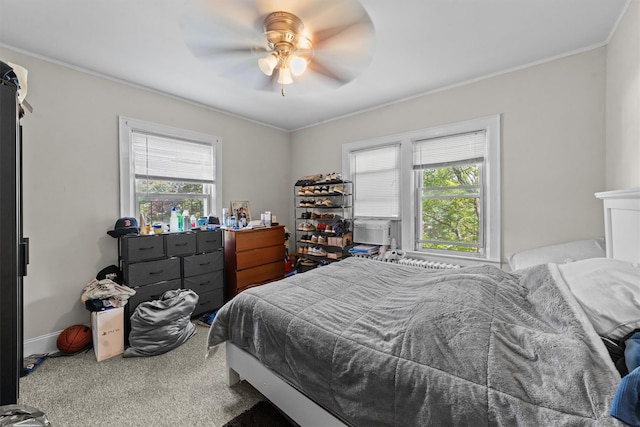107 Underhill Ave, West Harrison, NY 10604 - carpeted bedroom with multiple windows, ornamental molding, and a ceiling fan