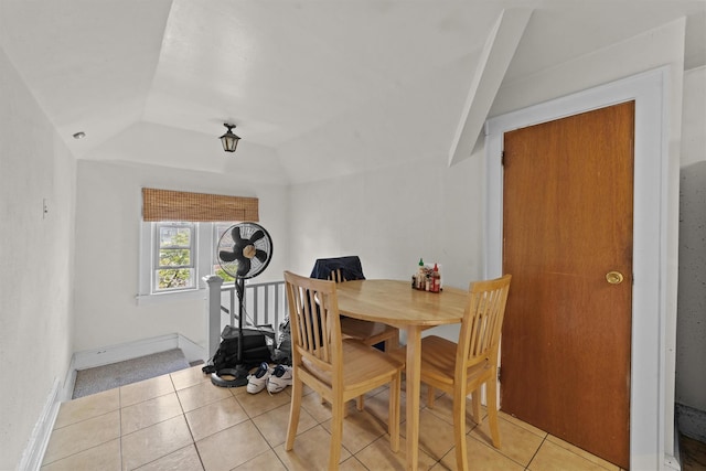 107 Underhill Ave, West Harrison, NY 10604 - dining room featuring light tile patterned flooring, vaulted ceiling, and baseboards