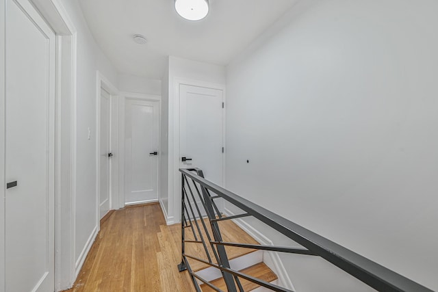 117-07 202nd St, Saint Albans, NY 11412 - corridor featuring an upstairs landing, light wood finished floors, and baseboards