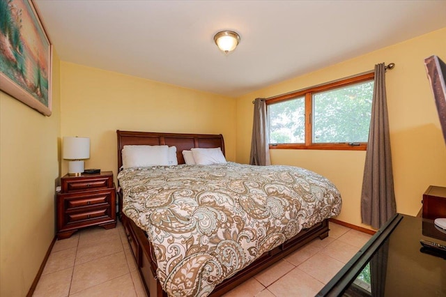 378 W Waukena Ave, Oceanside, NY 11572 - bedroom featuring baseboards and light tile patterned floors