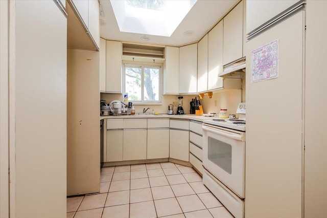 378 W Waukena Ave, Oceanside, NY 11572 - kitchen with white range with electric cooktop, light countertops, a skylight, light tile patterned floors, and under cabinet range hood