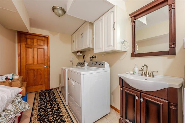 378 W Waukena Ave, Oceanside, NY 11572 - laundry room with washing machine and dryer, cabinet space, and light tile patterned floors