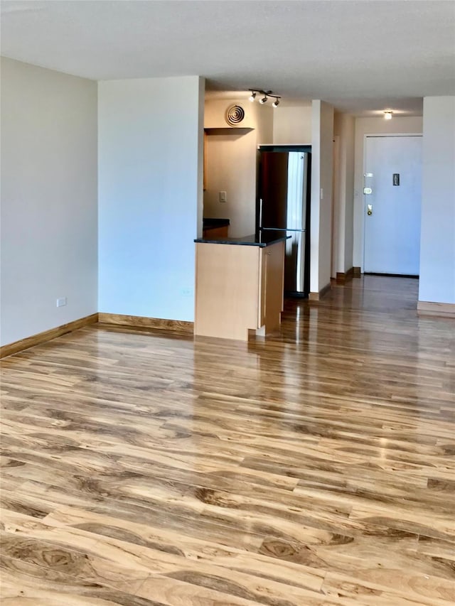 150-38 Union Tpke Unit 4D, Flushing, NY 11367 - unfurnished living room with wood finished floors and baseboards