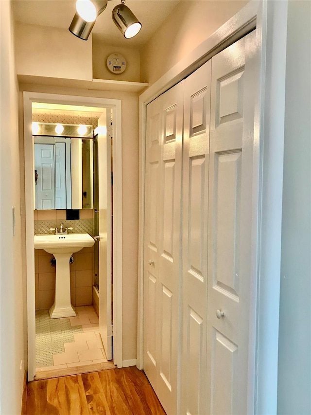 150-38 Union Tpke Unit 4D, Flushing, NY 11367 - bathroom featuring wood finished floors, a closet, and baseboards
