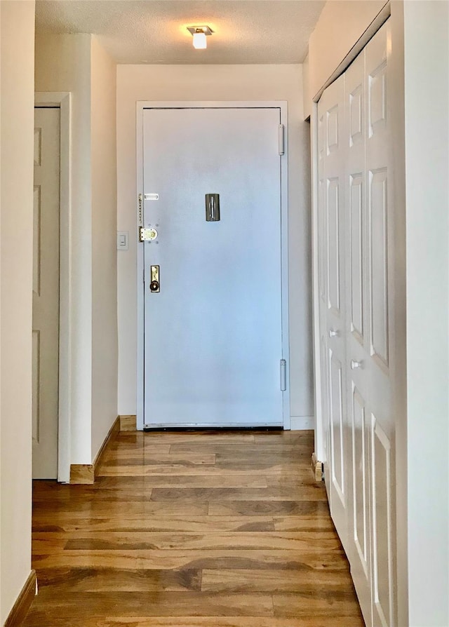 150-38 Union Tpke Unit 4D, Flushing, NY 11367 - doorway to outside with wood finished floors and baseboards