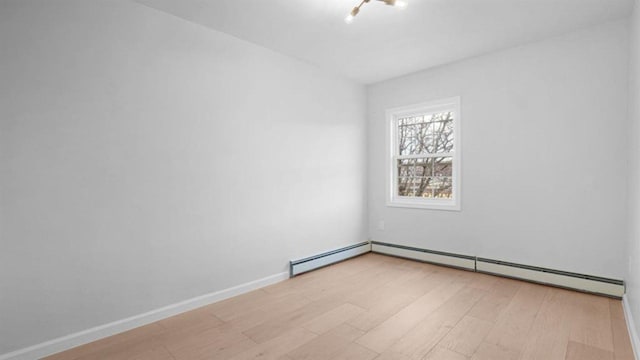 3412 Kingsland Ave, Bronx, NY 10469 - spare room featuring light wood-style floors and baseboards
