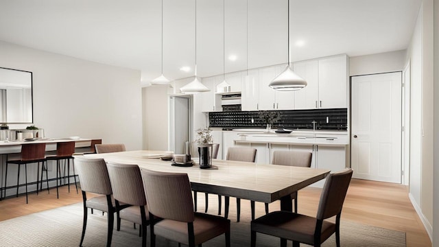3412 Kingsland Ave, Bronx, NY 10469 - dining room featuring light wood finished floors and recessed lighting