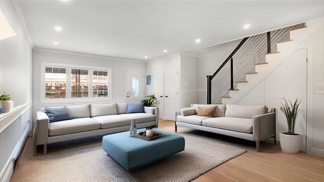 3412 Kingsland Ave, Bronx, NY 10469 - living room featuring stairway, crown molding, light wood-style flooring, and recessed lighting