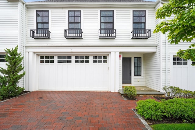 5 Rose Ln, Rye Brook, NY 10573 - view of front facade with a garage and decorative driveway