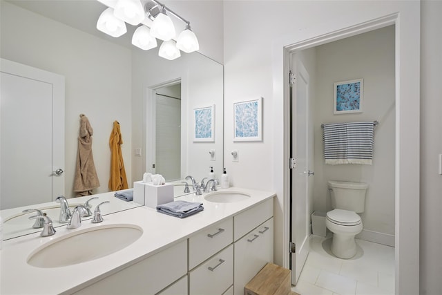5 Rose Ln, Rye Brook, NY 10573 - bathroom featuring double vanity, tile patterned floors, toilet, and baseboards