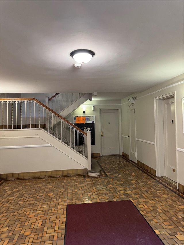 10 Welwyn Rd Unit 3E, Great Neck, NY 11021 - stairway featuring brick patterned floors